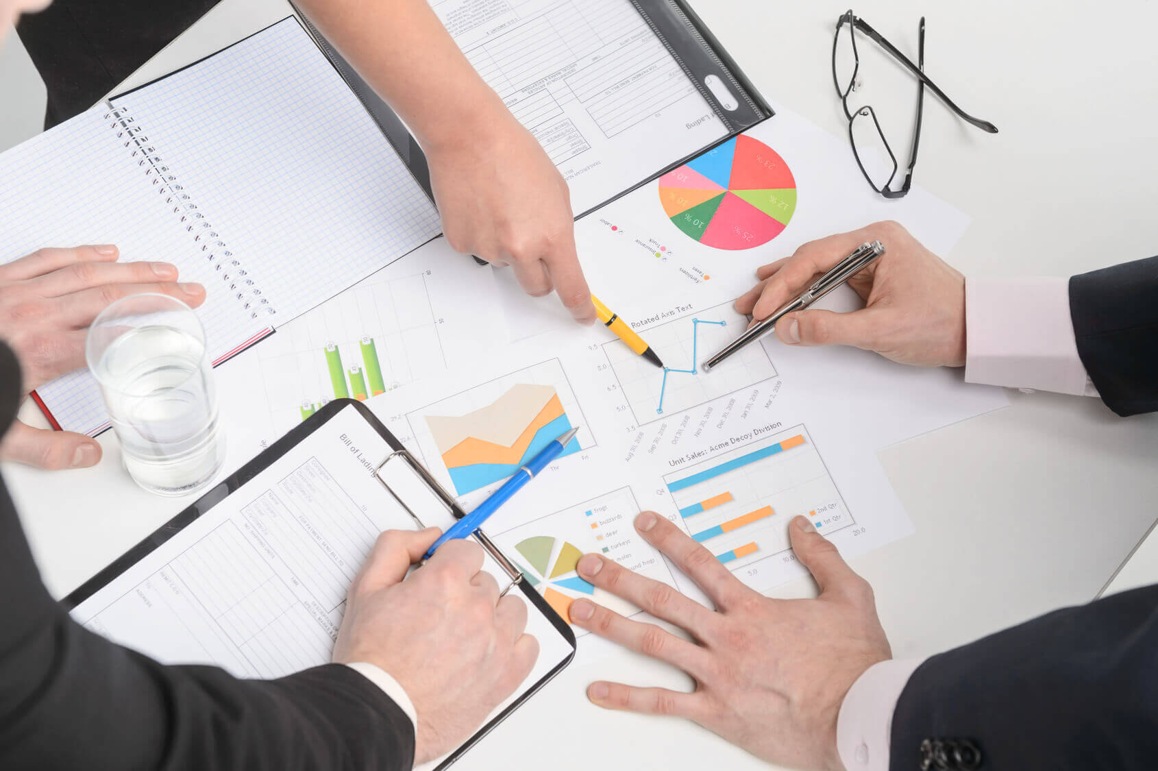 Owner reviewing financial paperwork in the shop