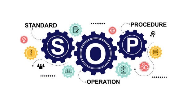 Worker documenting a process in the shop